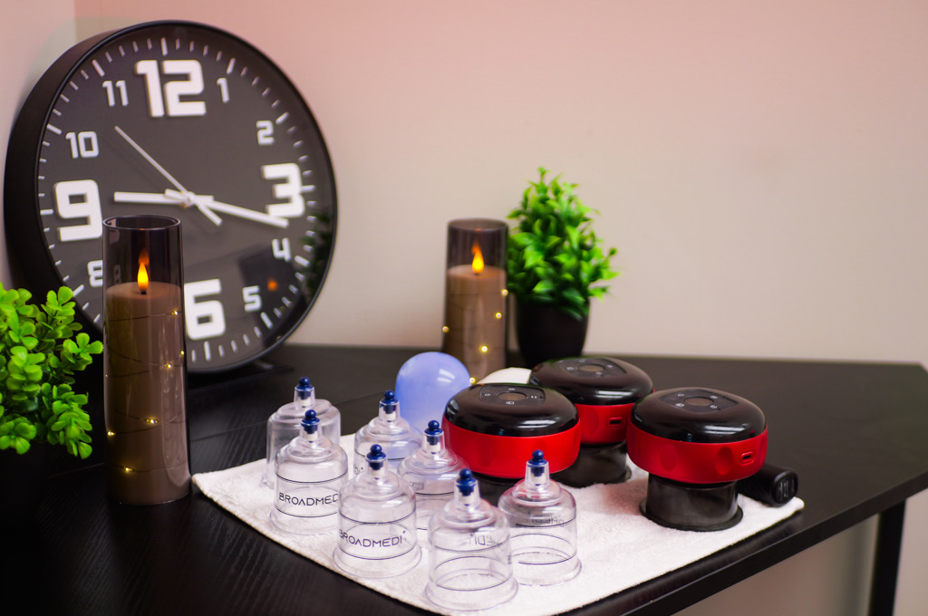 Cupping sets and candles arranged on a table in the treatment room